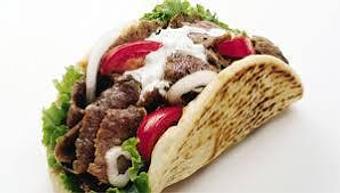 Product: Gyro Sandwich on pita bread with lettuce, tomato, onion, and Tzatziki sauce - Orabis Greek Mediterranean Restaurant in Cedar Hill, TX Mediterranean Restaurants