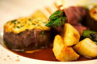 Product: Beef medallions, parmesan crusted, seared in a truffled mustard demi glace with prosciutto wrapped asparagus and roasted potatoes - Pasta D'arte Trattoria Italiana in Chicago, IL Italian Restaurants