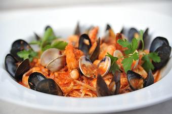 Product: Linguini pasta tossed with clams, mussels, calamari, shrimp, octopus and bay scallops simmered in a spicy white wine and tomato sauce - Pasta D'arte Trattoria Italiana in Chicago, IL Italian Restaurants