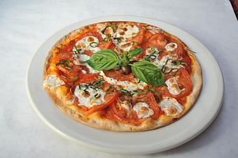 Product: Thin crust topped with fresh mozzarella, fresh tomato and basil - Pasta D'arte Trattoria Italiana in Chicago, IL Italian Restaurants