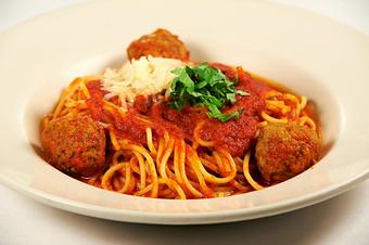 Product: Spaghetti tossed in tomato sauce with our homemade meatballs - Pasta D'arte Trattoria Italiana in Chicago, IL Italian Restaurants