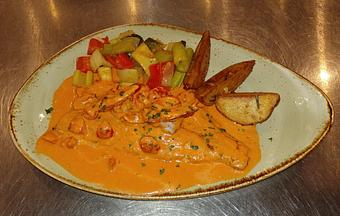 Product: Pan seared fresh rainbow trout topped with cherry tomatoes,
shrimp and lobster sauce - Pazzo Pomodoro in Vienna, VA Italian Restaurants