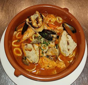 Product: PEI mussels, clams, fish, calamari & shrimp stew, garlic rubbed crostini - Pazzo Pomodoro in Vienna, VA Italian Restaurants