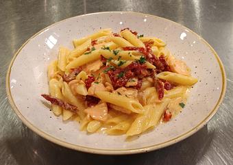 Product: Penne pasta and smoked salmon in a light cream sauce with sun dried tomatoes - Pazzo Pomodoro in Vienna, VA Italian Restaurants