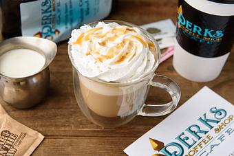 Product: Hot or cold.  Vanilla latte with caramel and whip cream. - Perks Coffee Shop & Cafe in Gulfport, MS Bakeries