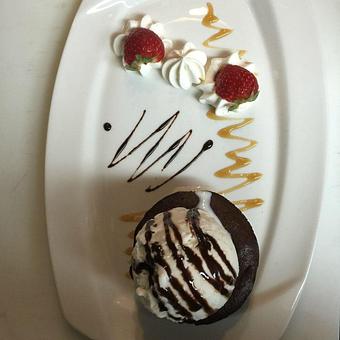 Product: Chocolate Truffle Torte with Vanilla Bean Ice Cream - Plaza Grill in Marathon, FL American Restaurants