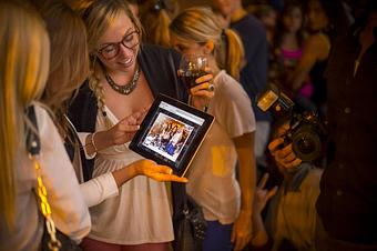 Product: Seconds later, guests can view and share the moments our event photographers captured. - Pose: Designed Photo Experience in Fort Point District - Boston, MA Photofinishing Laboratories