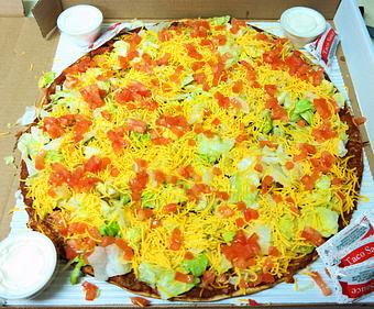Product: Large (16") Taco Pizza. Taco Meat, Cheese, Lettuce, Cheddar Cheese, & Tomato. Served with sour cream and taco sauce. - Powerhouse Pizza in Camden, OH American Restaurants