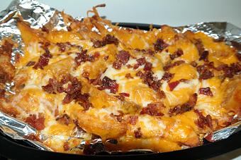 Product: Generous helping of potatoes, three cheeses, and bacon! - Powerhouse Pizza in Camden, OH American Restaurants