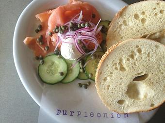 Product: thinly sliced smoked salmon, cucumber, capers, shaved red onion, plain and tomato cream cheese with choice of bagel - Purple Onion Cafe in Los Gatos / Campbell border - Los Gatos, CA American Restaurants