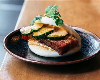 Product: crispy pork belly, tobanjan mayo and spicy pickles on a steamed bun - Ramen San in Chicago, IL Japanese Restaurants