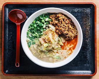 Product: a crowd favorite, and one of our OG bowls: our classic chicken broth with white miso, served with tokyo wavy noodles, spicy ground pork, blanched napa cabbage, and scallions, finished with szechuan peppercorn and ichimi - Ramen San in Chicago, IL Japanese Restaurants