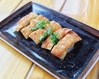 Product: five dumplings filled with berkshire pork and pan-fried. served with a gyoza soy sauce - Ramen San in Chicago, IL Japanese Restaurants
