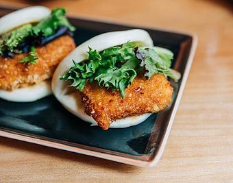 Product: marinated tofu breaded and fried, tossed in a sweet and spicy thai sauce, and served on a steamed bun with mixed greens - Ramen San in Chicago, IL Japanese Restaurants
