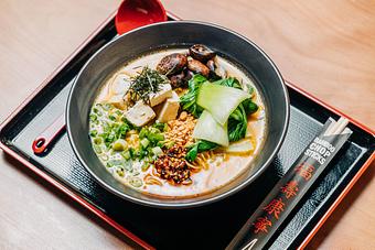 Product: our vegetarian option, veg broth with a rich sesame miso, braised cremini mushrooms, bok choy, fresh tofu, green onion, fried garlic, kizami nori, and sesame chili oil - Ramen San in Chicago, IL Japanese Restaurants