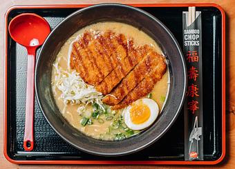 Product: traditional pork broth with mustard miso. served with tokyo wavy noodles, panko breaded pork loin, molten egg, shredded cabbage and green onion. topped with tonkatsu sauce - Ramen San in Chicago, IL Japanese Restaurants