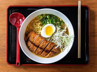 Product: traditional pork broth with mustard miso. served with tokyo wavy noodles, panko breaded pork loin, molten egg, shredded cabbage and scallion. topped with tonkatsu suace. - RAMEN-SAN Whisky Bar in Fulton Market - Chicago, IL Japanese Restaurants