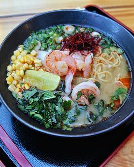 Product: a light and herbaceous ramen served with tokyo wavy noodles in a green curry vegetable broth with fresh herbs - RAMEN-SAN Whisky Bar in Fulton Market - Chicago, IL Japanese Restaurants
