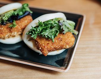 Product: marinated tofu breaded and fried, tossed in a sweet and spicy thai sauce, and served on a steamed bun with mixed greens - RAMEN-SAN Whisky Bar in Fulton Market - Chicago, IL Japanese Restaurants
