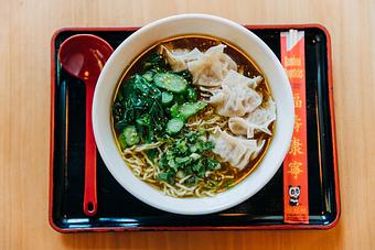 Product: inspired by a traditional wonton soup, this bowl features our chicken broth seasoned with a sweet soy tare, topped with 6 handmade chicken wontons, gai lan, green onions, and roasted white sesame seeds. - RAMEN-SAN Whisky Bar in Fulton Market - Chicago, IL Japanese Restaurants