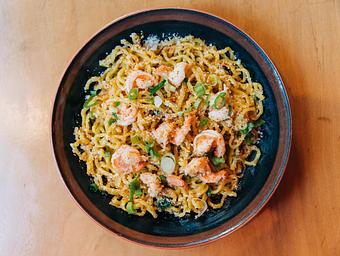 Product: this tossed noodle mazemen features temomi noodles in a creamy garlic sauce with parmesan cheese, poached shrimp, scallions and finished with dried shrimp powder, ichimi and rayu - RAMEN-SAN Whisky Bar in Fulton Market - Chicago, IL Japanese Restaurants