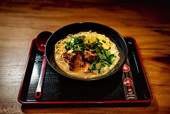 Product: from our collaboration with Fred Noinaj, this ramen features tender braised pork with anise, house-made pickled mustard greens, scallion, cilantro, and a marinated egg - RAMEN-SAN Whisky Bar in Fulton Market - Chicago, IL Japanese Restaurants