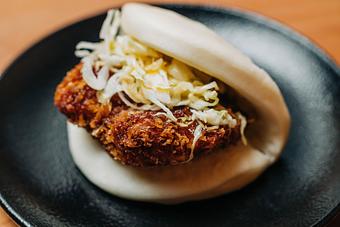 Product: fried chicken, spicy mustard, japanese bbq sauce and kewpie mayo on a steamed bun - RAMEN-SAN Whisky Bar in Fulton Market - Chicago, IL Japanese Restaurants
