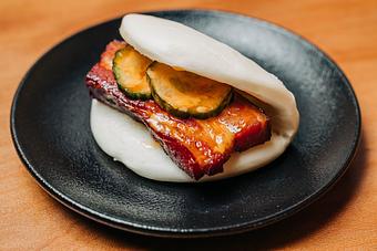 Product: crispy pork belly, tobanjan mayo and spicy pickles on a steamed bun - RAMEN-SAN Whisky Bar in Fulton Market - Chicago, IL Japanese Restaurants