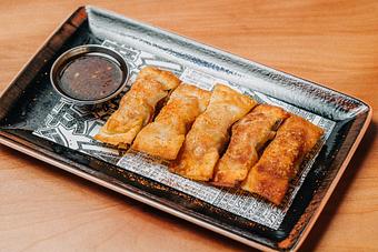 Product: five handmade dumplings filled with berkshire pork and onion. served with a chili garlic soy sauce. - RAMEN-SAN Whisky Bar in Fulton Market - Chicago, IL Japanese Restaurants