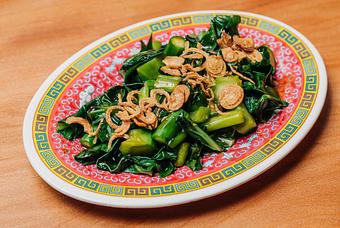 Product: blanched chinese broccoli topped with oyster sauce and crispy shallots - RAMEN-SAN Whisky Bar in Fulton Market - Chicago, IL Japanese Restaurants
