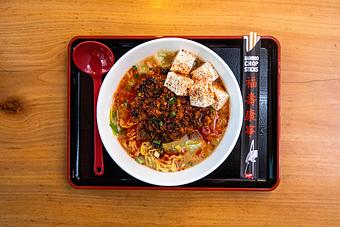 Product: this traditional Sichuan dish features our savory 10-hr tonkotsu broth, served with tokyo wavy noodles and topped with spicy ground pork, tofu, leeks and finished with ground szechuan peppercorn. - RAMEN-SAN Whisky Bar in Fulton Market - Chicago, IL Japanese Restaurants
