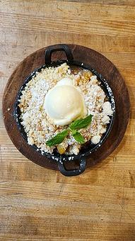 Product: Housemade Peach Cobbler a la mode - Red Table in Huntington Beach, CA American Restaurants