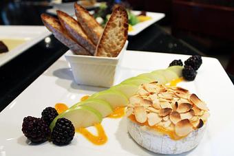 Product: Almond Crusted Baked Brie - Revelry Pub & Grill in Sarasota, FL American Restaurants