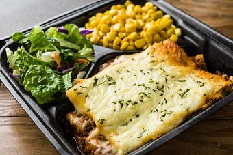 Product: A generous portion of homemade baked lasagna plus 2 sides - Rice & Roux in Baton Rouge, LA American Restaurants