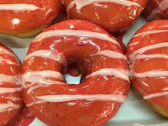 Product: Strawberry glaze donut - Rickey Meches Donuts in Lafayette, LA Bakeries