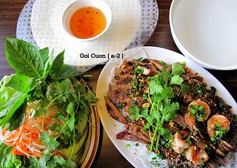 Product: Combination of grilled pork, beef, chicken and shrimp.  Served with mixed veggies, rice noodle, rice paper and special house sauce - Saigon Wings Restaurant in Colorado Springs, CO Vietnamese Restaurants