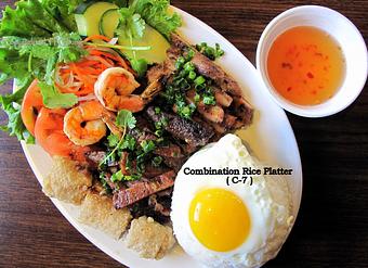 Product: Grilled pork, beef, chicken, shrimp, egg roll and fried egg.  Serve with steamed rice & house salad.  Serve with steamed rice & house salad - Saigon Wings Restaurant in Colorado Springs, CO Vietnamese Restaurants