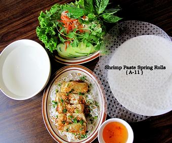 Product: Deep fried shrimp paste wrapped in rice paper.  Served with mixed veggies, rice noodle, rice paper and special house sauce - Saigon Wings Restaurant in Colorado Springs, CO Vietnamese Restaurants