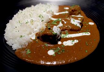 Product: beef brisket, eighteen-spice curry sauce, charred garlic oil, yogurt - Sakamai in Lower East Side - New York, NY Japanese Restaurants
