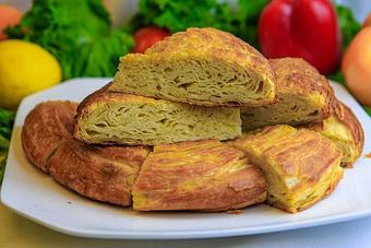 Product: A buttery, flaky and savory layered Uzbek bread - Samarkand Restaurant in Feasterville - Feasterville Trevose, PA Seafood Restaurants