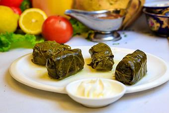 Product: Uzbek grape leaves stuffed with rice, lamb, and beef.
Served with side of sour cream - Samarkand Restaurant in Feasterville - Feasterville Trevose, PA Seafood Restaurants