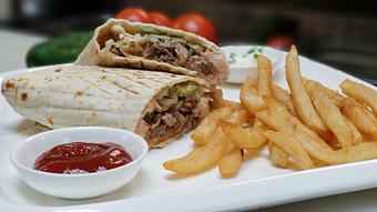 Product: Marinated chicken stacked and slow roasted on a vertical Shawarma grill, and wrapped with fresh cucumbers, tomatoes, lettuce, and house made Tzatziki sauce - Samarkand Restaurant in Feasterville - Feasterville Trevose, PA Seafood Restaurants