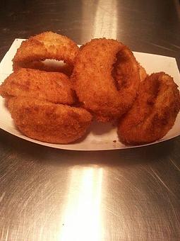 Product: One of our many signature items is our hand-breaded onion rings.  They are fantastic alone or add one of our sauces to make this classic even better! - Sandi's Drive Inn in Richfield, UT Hamburger Restaurants