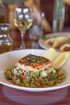 Product: Mediterranean chopped salad with grilled salmon - Seafood Peddler in Sausalito, CA American Restaurants