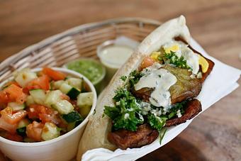 Product: thick rounds of fried eggplant that melt like butter in your mouth, combined with a hard boiled egg and served in a warm pita with israeli salad and homemade tahini. - Shaloha in Honolulu, HI Mediterranean Restaurants