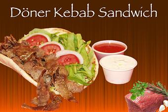 Product: Tender kebab meat (lamb & beef mix OR chicken) topped with special Tzatziki sauce,
shredded lettuce, pickled red cabbage,onion and tomato served in 7" greek pita. - Shondiz Cafe in Right in front of Hard Rock Cafe - Denver, CO Greek Restaurants