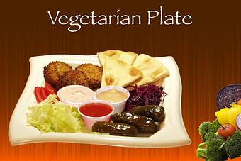 Product: Four falafels, four dolma rolls, 2 Oz hummus, served on a plate with special Tzatziki
sauce, shredded lettuce, pickled red cabbage, onion, tomato and 7" greek pita. This item can be made Vegan. - Shondiz Cafe in Right in front of Hard Rock Cafe - Denver, CO Greek Restaurants