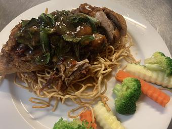 Product: Crispy duck with a spicy sauce and fresh basil - Siam Queen Thai Bistro in Carlsbad, CA Thai Restaurants