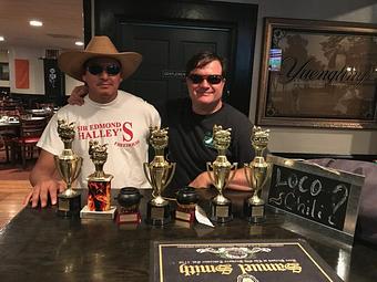 Product: Svend & Jairo with there 1st place trophies for 7 years of chili cook offs - Sir Edmond Halley's in Myers Park - Charlotte, NC Hamburger Restaurants