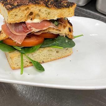 Product: prosciutto, spinach, tomato, roasted garlic aioli, herbed
foccacia - SKYBOKX 109 Sports Bar & Grill in Across from the Natick Mall - Natick, MA American Restaurants